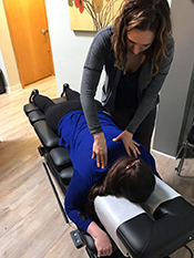 Dr. Erin Anderson chiropractic on patient